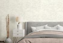Empty grey wall in modern and cozy bedroom. Mock up interior in