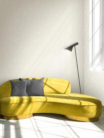 Cozy yellow sofa in living room in sunlight shadow pattern